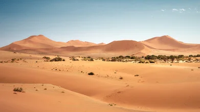 Photo art by Norbert Gräf: landscape of the Namib Desert featuring gentle dunes.