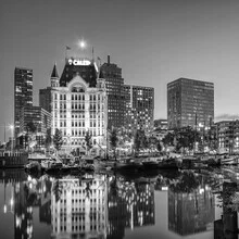 Evening city view of Rotterdam featuring the Witte Huis and lights in the Old Harbour