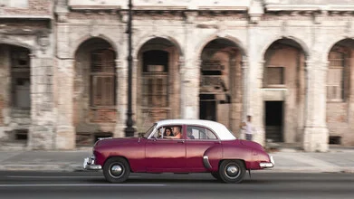 Photo art by Tillmann Konrad: Classic car cruising along Malecón at sunset.