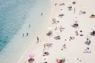Photo art: relaxed beach scene with umbrella and people in Calabria.
