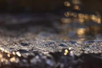 Photo art by Mareike Böhmer: close-up of waves with gentle sunset colors