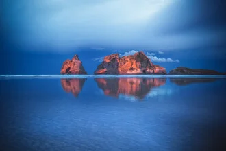 Photo art by Jean Claude Castor: Wharariki Beach at sunset with alpenglow