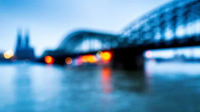 Charming view of the Rhine with a bridge and Cologne Cathedral in the rain