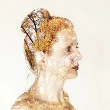 Autumn portrait featuring golden leaves and a gentle mood.