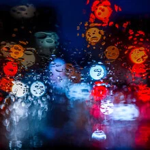 Photo art featuring colorful raindrops on a smooth surface.