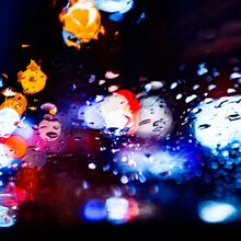 Photo art showing colorful raindrops on a smooth surface