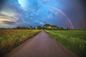 Photo art by Jean Claude Castor: Rainbow over a Tuscan landscape after a thunderstorm.
