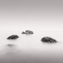 Photo art by Dennis Wehrmann: tranquil sea scene with gentle waves and stones.