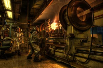 Photo art by Jan Glebinski: men working with machines and fire.