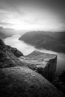 Photo art: Black-and-white shot of Preikestolen in Norway, featuring dramatic lighting.