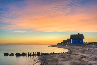 Photo art by Michael Valjak: blue house by the Baltic Sea at sunrise.