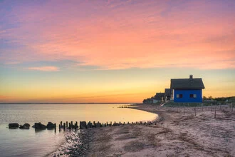 Photo art by Michael Valjak: blue house by the sea in Heiligenhafen at sunrise.