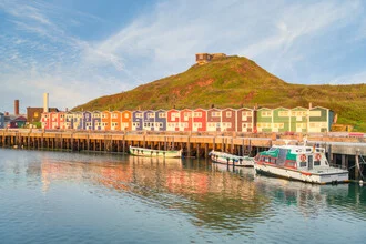 Photo art by Michael Valjak: lobster shacks at Heligoland harbor in morning light