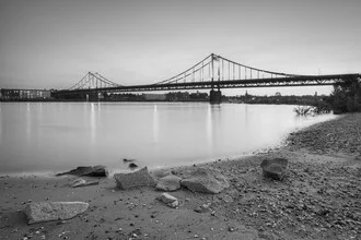 Black and white photo of the Rhine bridge Krefeld-Uerdingen at dusk.
