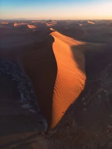 Photo art by Jean Claude Castor: Evening mood over a dune in Namibia