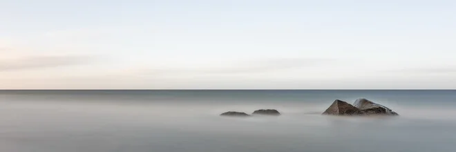 Photo art by Dennis Wehrmann: gentle waves and stones by the sea