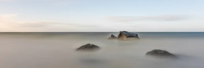 Photo art by Dennis Wehrmann: calm waves and stones by the Baltic Sea