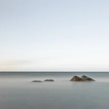 Photo art by Dennis Wehrmann: calm Baltic Sea with gentle waves and stones