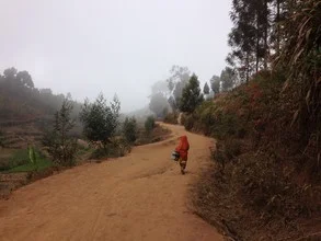 Photo art: A girl hiking through the misty Usambara Mountains in Tanzania.