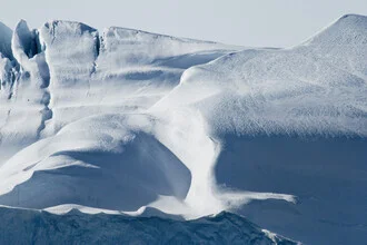 Photo art by Victoria Knobloch: icy iceberg in Greenland under a clear sky
