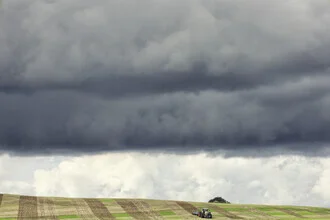 Beautiful photo by Manuela Deigert: harvest time with dramatic clouds and tractor.