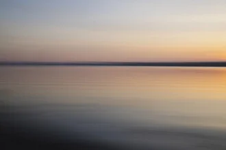 Blurred sunset over the Baltic Sea with soft color gradients