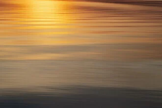 Blurred golden sunset over the Baltic Sea.