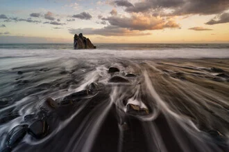 Beautiful sunset over the sea on Madeira with dramatic clouds.
