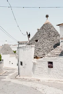 Photo art by Photolovers: Trulli houses in white and blue in Alberobello, Italy.