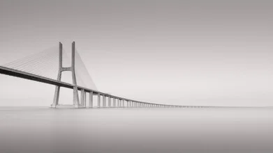 Long exposure of the Vasco da Gama Bridge in Lisbon with calm waters