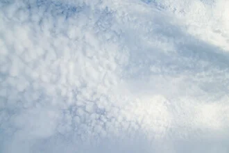 Cloudy sky with gentle patterns, conveying a calm atmosphere