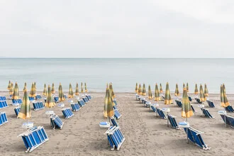Photo art by Photolovers: relaxed beach scene in Calabria with a beach umbrella