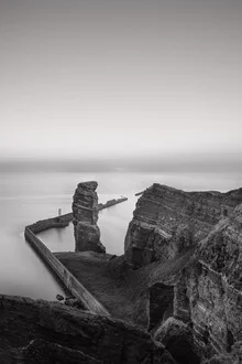Photo art by Dennis Wehrmann: Lange Anna in Helgoland at sunset over the ocean