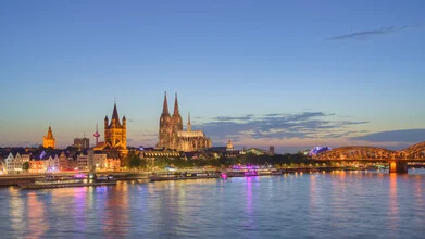 Photo art by Michael Valjak: Cologne skyline at dusk with illuminated buildings