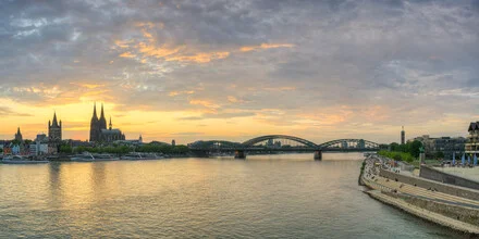 Photo art by Michael Valjak: panoramic view of Cologne skyline at sunset.