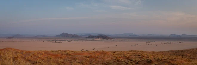 Beautiful landscape featuring mountains and sunset in Namib Naukluft Park, Namibia.