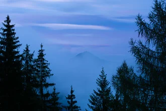 Photo art by Martin Wasilewski: mountain landscape in fog at sunset.