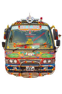 Sad truck in bright colors, adorned with traditional truck art from Pakistan.