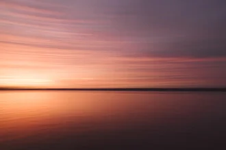 Evening mood on the Baltic Sea with soft colors and calm water