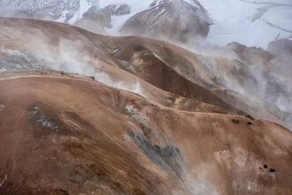 Steaming mountains in Iceland featuring geothermal springs in the highlands.