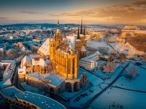 Erfurt Cathedral in winter, soft snow covering the historical architecture.