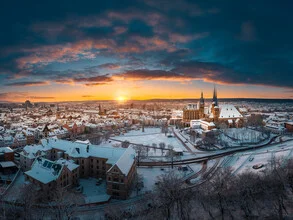 Winter sunrise over Erfurt featuring soft colors and a serene atmosphere.