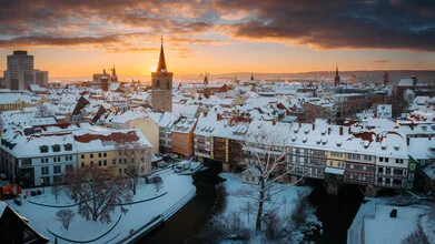 Morning mood at the Krämerbrücke in Erfurt, featuring calm water and soft colors.