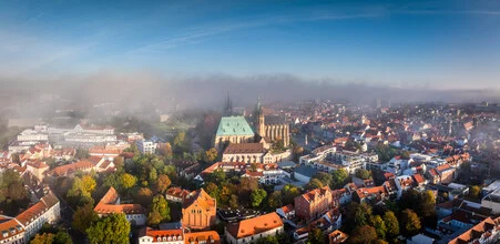 Panoramic view of Erfurt's old town in autumn with gentle mist.