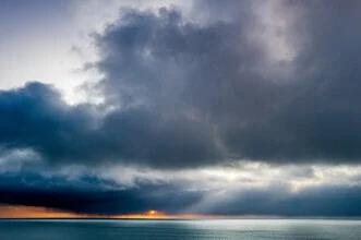 Coastal landscape in Iceland with rain clouds over the sea