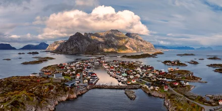 Aerial view of Henningsvaer in Lofoten: coastline and blue waters