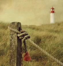 Photo art by Hannes Cmarits: dune landscape with a lighthouse in the background