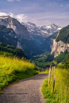 Beautiful photo art by Achim Thomae: Summer in Lauterbrunnen Valley with mountains and waterfall.