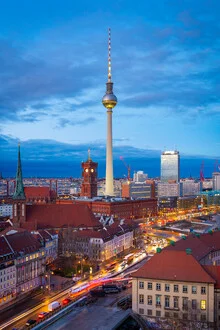 Photo of Berlin at dusk featuring the TV tower and the Red Town Hall.