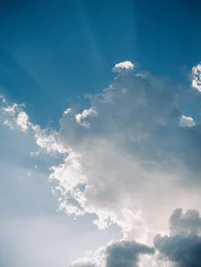 Photo art featuring warm colors: abstract sky with clouds and the sun.